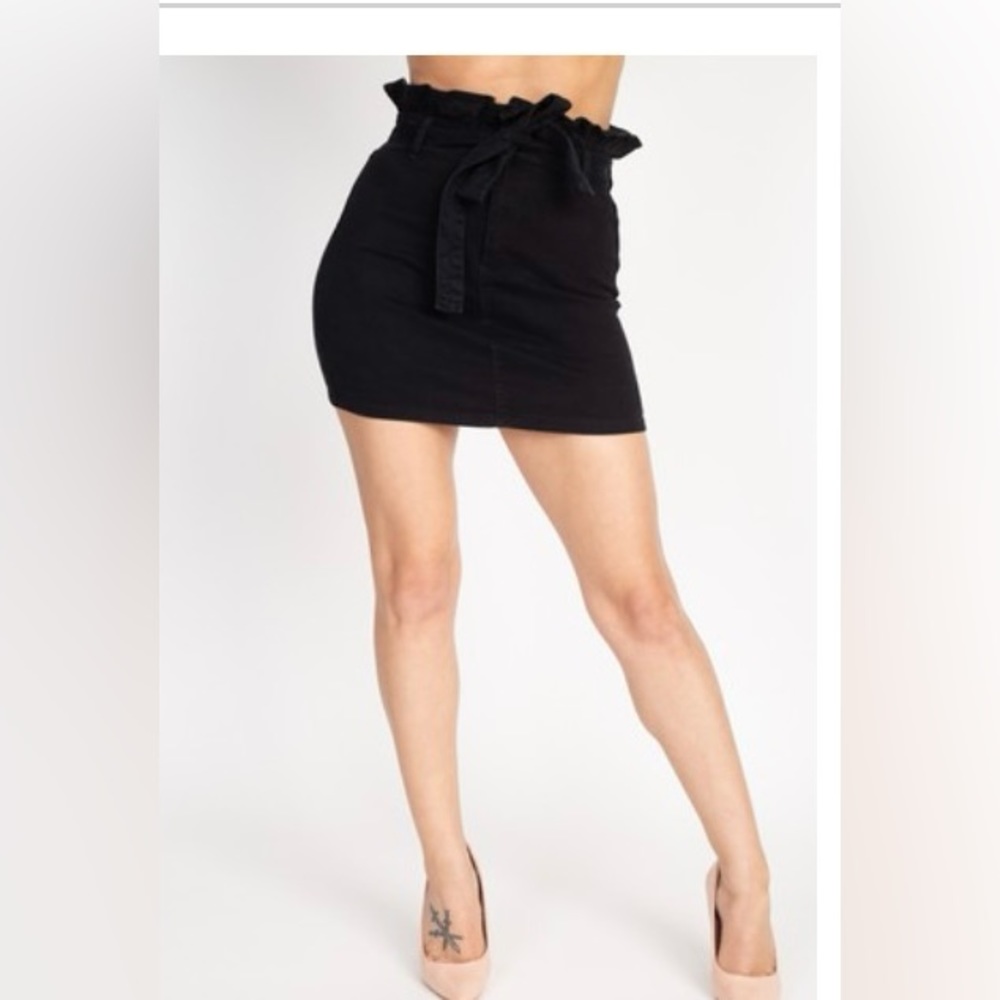 Denim mini skirt with paper bag style waist.